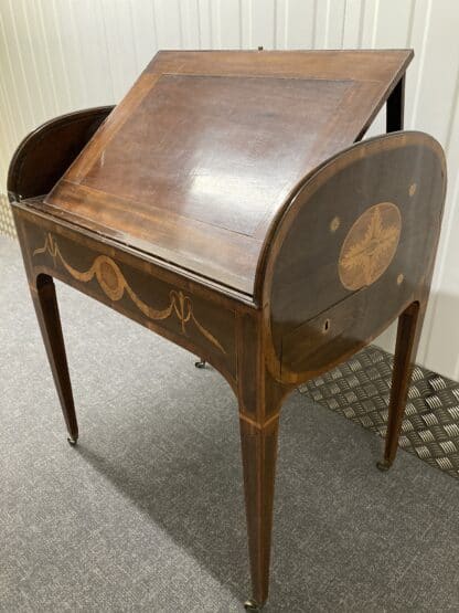 Alternate side view of desk with tambour open and writing pad at extended angle